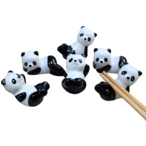 Ositos panda kawaii japoneses para apoyar los palillos